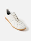 The Novesta for Universal Works Off-White/White Leather German Army Trainer on a white background. The shoe is leather with a gum sole and white laces.