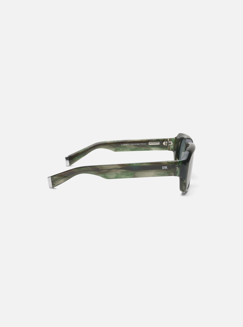 Side view of A. SOCIETY x Universal Works Green Aberdeen Sunglasses on a white background. Green marbled frames with silver accents. 'UW' logo on the side.