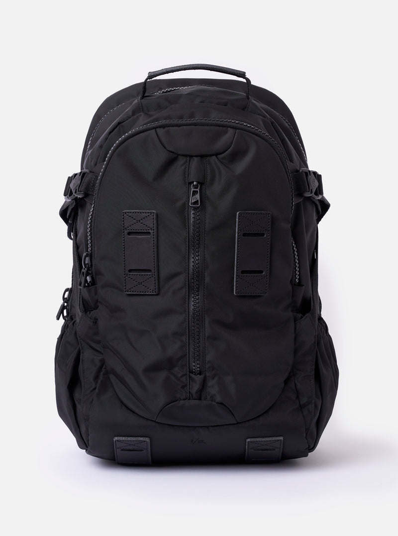 Black backpack on a light gray background