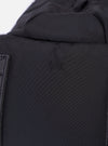The F/CE. Black Recycled Nylon 420 re/cor Travel Backpack is shown from the back as a flat lay against a plain white background. The image highlights the padded mesh back panel, the ergonomically curved shoulder straps with adjustable webbing, and the top carry handle. The black recycled nylon fabric has a subtle sheen.