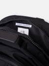 The F/CE.® Black Recycled Nylon 420 re/cor Travel Backpack is shown from the back as a flat lay against a plain white background. The image highlights the ergonomic, curved shoulder straps featuring the Mounting T System and a small embroidered logo. The back panel is padded with a smooth, black material.