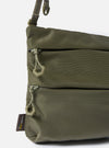 Close-up of the F/CE.® Sage Green 420 re/cor Sacoche. Features a sage green Cordura material, two zippered pockets, and a matching strap. Shot on a white background.