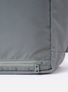 The F/CE.® Foliage Green Recycled Nylon 420 re/cor Courier Shoulder Bag is shown as a flat lay against a plain white background. The image highlights the rear and side profile of the bag, showcasing the durable, textured recycled nylon fabric in a muted foliage green. The wide, adjustable messenger-style shoulder strap and technical webbing details are prominent.
