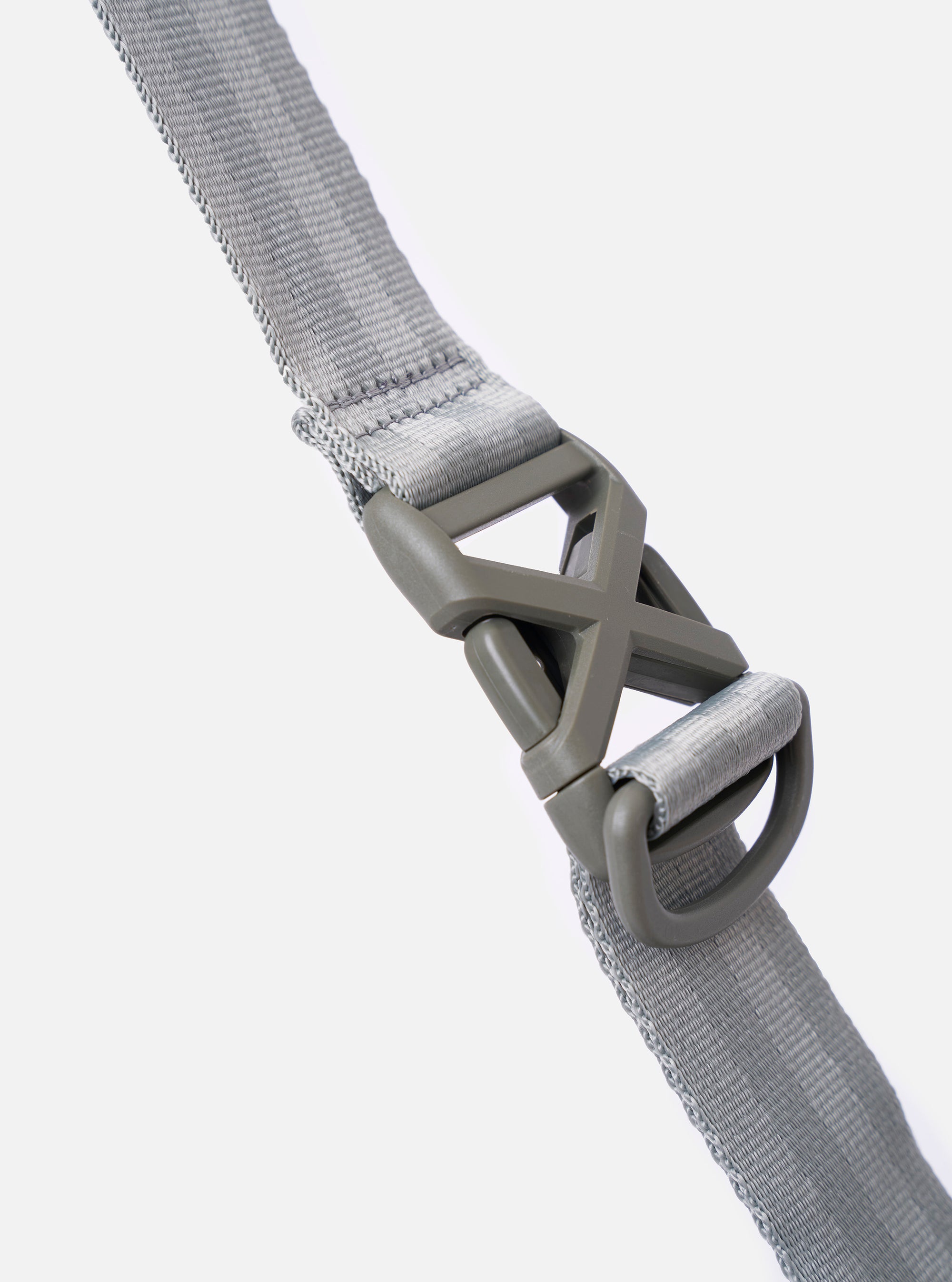 The F/CE.® Foliage Green Recycled Nylon 420 re/cor Courier Shoulder Bag is shown from a side-profile angle as a flat lay against a plain white background. The image highlights the bag's depth, the adjustable messenger-style shoulder strap with a one-touch buckle mechanism, and the durable recycled nylon fabric in foliage green.