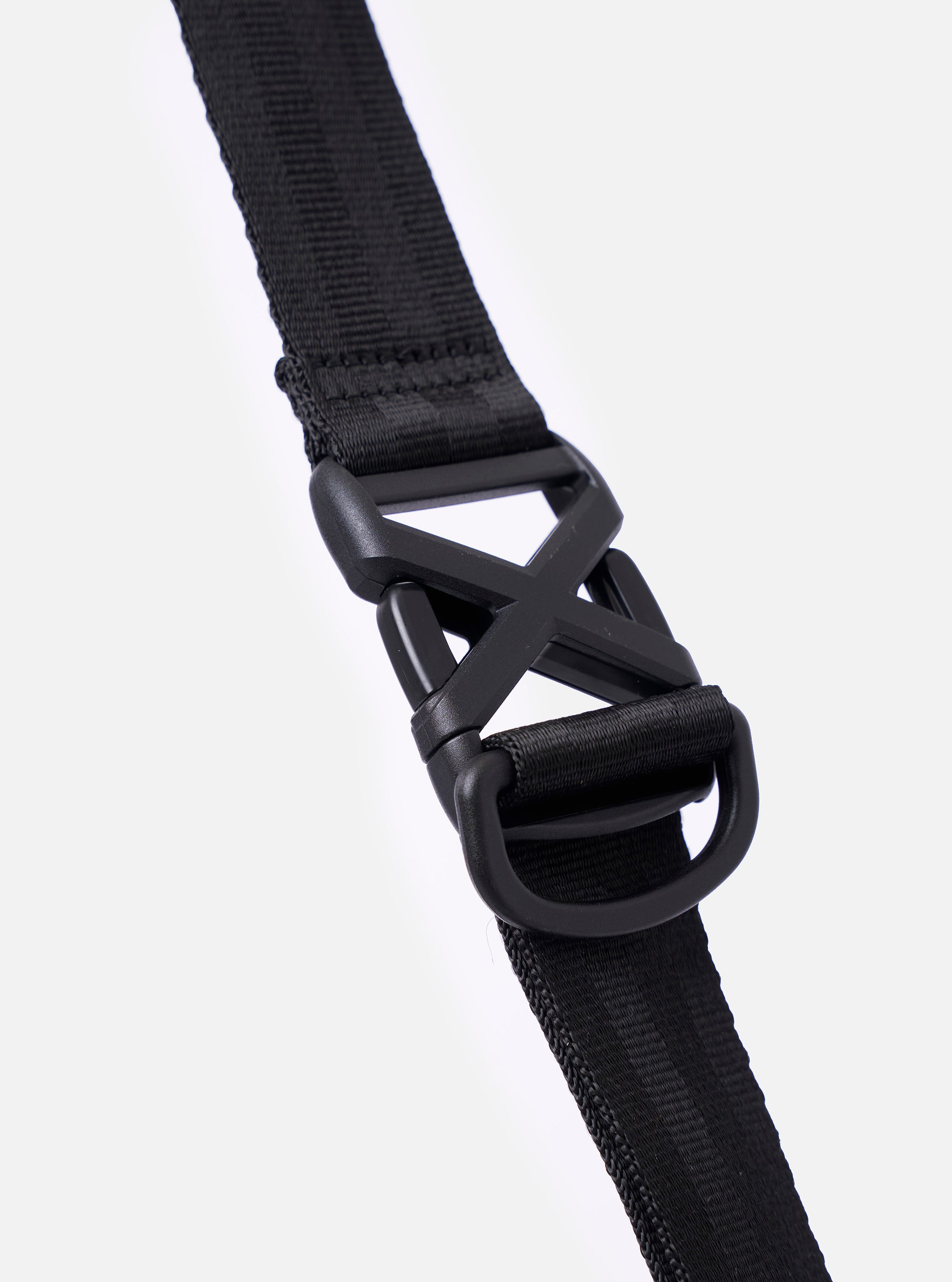 The F/CE. Black Recycled Nylon 420 re/cor Courier Shoulder Bag is shown from a rear angle against a plain white background. The image highlights the adjustable messenger-style shoulder strap and the smooth, technical texture of the black recycled nylon fabric.