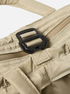 Close-up of the F/CE.® Sage Green Recycled Twill 3-Way Helmet Bag. Shows the twill material, black buckle, and zipper. The bag is on a white surface.