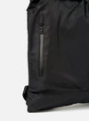 Close-up of the F/CE.® Black Recycled Twill 3-Way Helmet Bag, showing the material and zipper detail. The bag is on a white background.