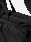 Close-up of the F/CE.® Black Recycled Twill 3-Way Helmet Bag showing the material, stitching, and zipper details against a white backdrop.
