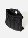Open F/CE.® Black Recycled Twill 3-Way Helmet Bag on a white background. The bag is made of black twill and has a zipper closure. The interior is black.