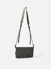 The F/CE.® Charcoal Nylon Textured Twill Drawstring Sacoche bag in charcoal nylon twill with a woven strap, displayed on a white background.