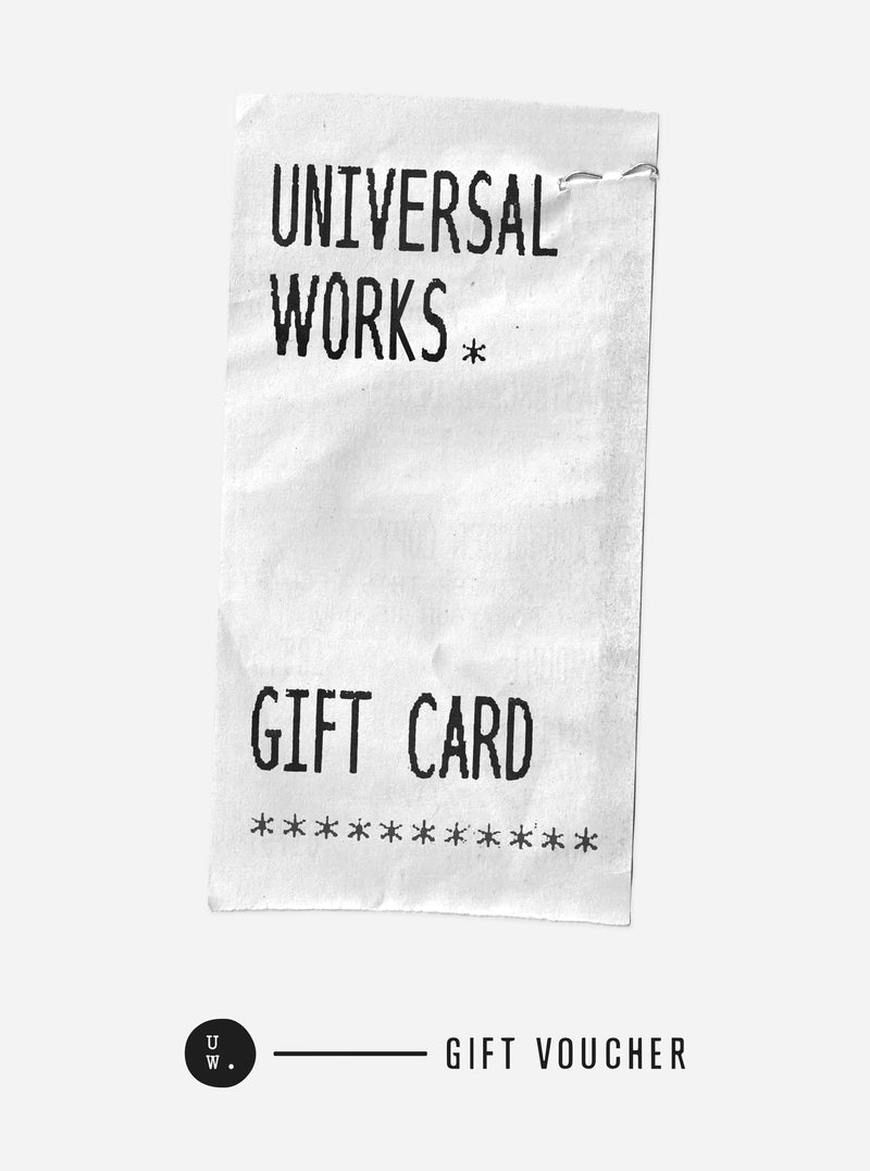 Close-up of a Universal Works – Gift Card on a white background. The card is white with black text. The text includes the brand name and the words "Gift Card" and "Gift Voucher".
