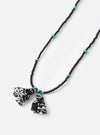 Hanami of Rome Matte Black/Turquoise Bead Necklace No.58 on a white surface. Features black beads, turquoise accents, and black/white patterned fabric tassels.
