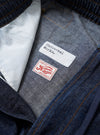 The Indigo Kaihara LT WT Denim Hi Water Trouser is shown as a flat lay against a plain white background. The trousers feature an elasticated waistband with a drawstring, a relaxed fit through the leg, and a cropped hem. The garment is made from a lightweight indigo blue denim fabric with visible seam detailing.