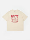 The Kappy Cream Sundance Lounge Half Tee is shown as a flat lay against a white background. The cream-colored t-shirt features a contrasting orange graphic print on the front inspired by holidays. It has a relaxed fit, a simple crew neckline with visible chain stitching, and half-length sleeves.