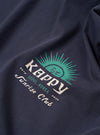 The Kappy Vintage Navy Sunny Wink Half Tee is shown from the back as a flat lay against a plain white background. The image highlights the clean construction of the garment's rear, the oversized fit, and the smooth vintage navy cotton fabric. A small, subtle brand label is visible at the bottom hem.