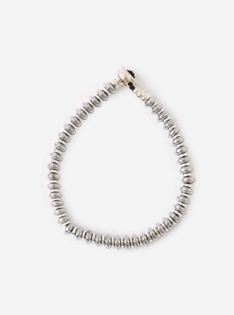 The Mikia Hematite Roundel Bracelet on a white background. The bracelet features gray hematite beads and a silver clasp.