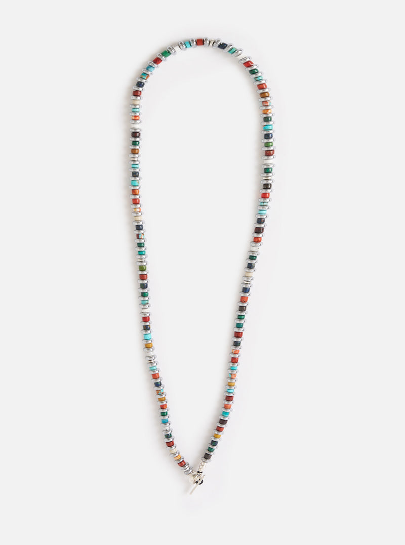 The Mikia Multi Hematite Roundel Necklace on a white background. The necklace features colorful roundel beads with hematite spacers.