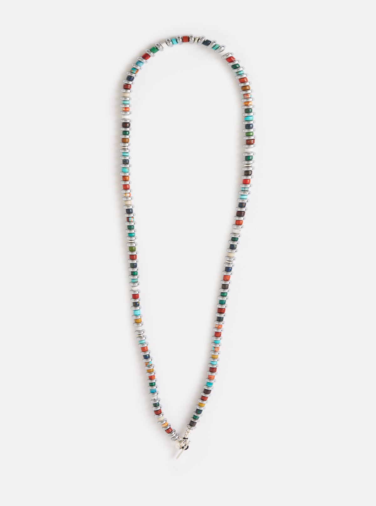 The Mikia Multi Hematite Roundel Necklace on a white background. The necklace features colorful roundel beads with hematite spacers.