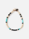 The Mikia Fossil Jasper/Turquoise Heishi Beads Bracelet on a white background. The bracelet features fossil jasper, turquoise, and black heishi beads.