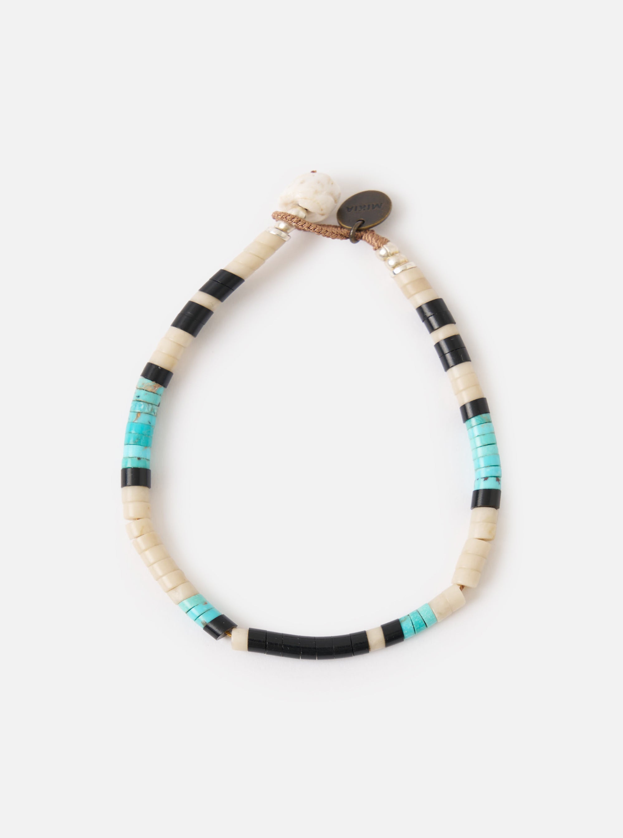 The Mikia Fossil Jasper/Turquoise Heishi Beads Bracelet on a white background. The bracelet features fossil jasper, turquoise, and black heishi beads.