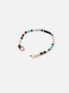 Mikia Fossil Jasper/Turquoise Heishi Beads Bracelet on a white background. The bracelet features turquoise, black, and cream beads. The bracelet has a brown cord and a metal clasp.