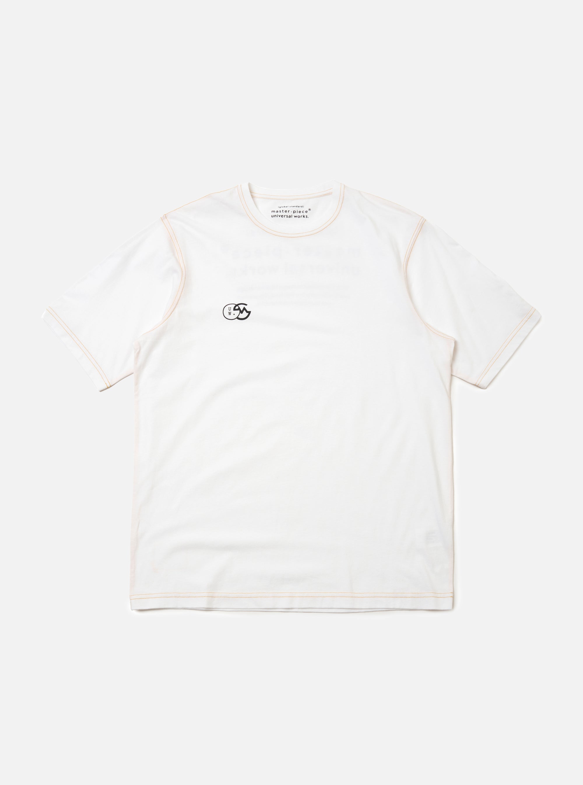 The master-piece x Universal Works White Single Jersey Print Tee is shown as a flat lay against a plain white background. This short-sleeved white t-shirt features a simple ribbed crew neckline and a relaxed fit. A small, dark graphic is printed on the left chest area, and a logo patch is visible near the front hem.