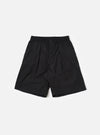The master-piece x Universal Works Black Recycled Poly Tech Pleated Track Short is shown as a flat lay against a white background. The shorts feature a relaxed, loose fit with a single pleat on each leg and an elasticated waistband. The design includes a button closure, zip fly, and two side hand pockets.