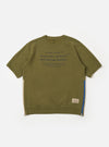 The master-piece x Universal Works Olive Brush Back Sweat S/S Billy Sweat is shown as a flat lay against a white background. This short-sleeved sweatshirt features a ribbed crew neckline, a single chest patch pocket on the left side, and a relaxed fit with finished cuffs and hem. The olive green fabric has a soft, matte appearance.