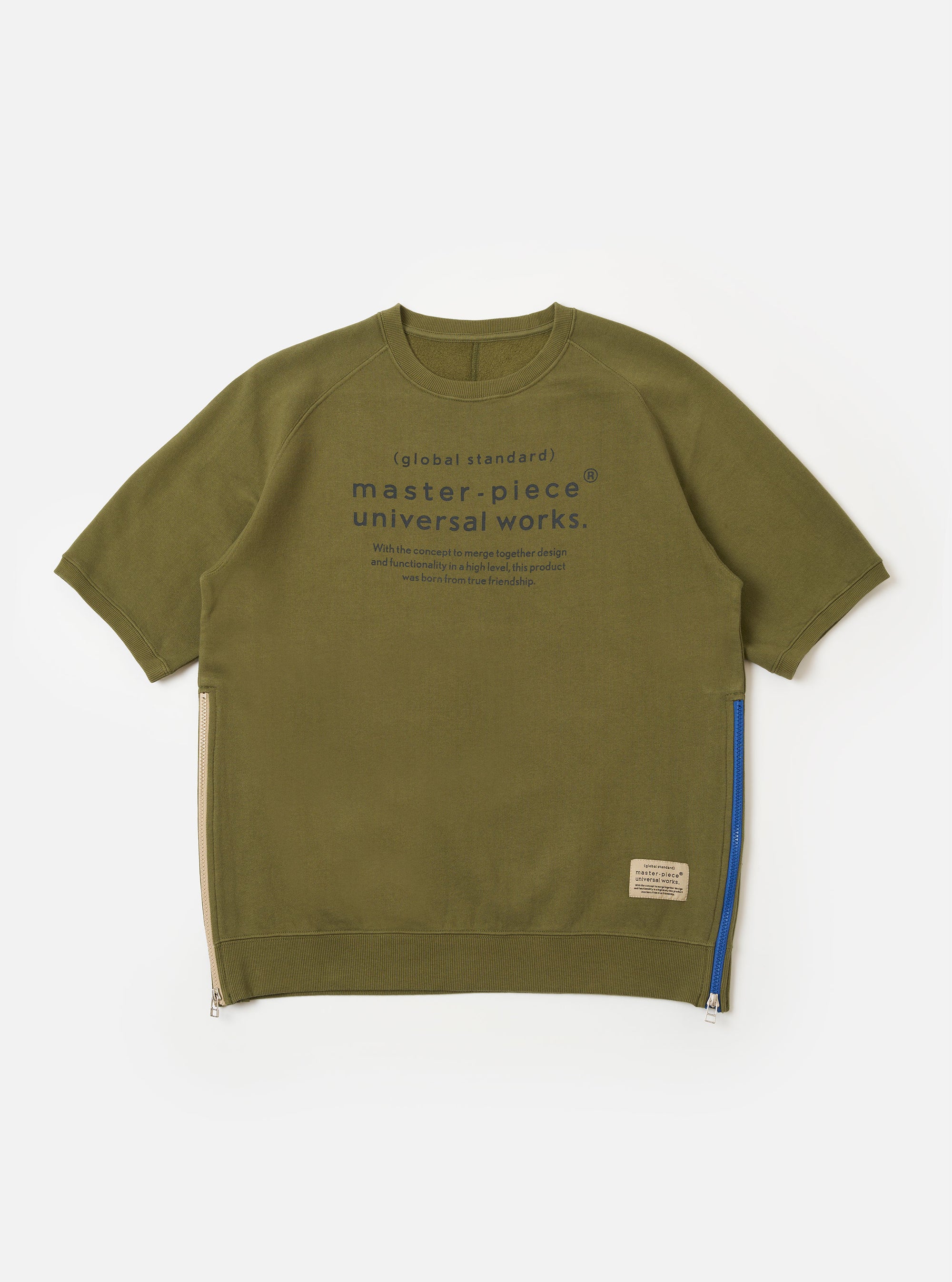 The master-piece x Universal Works Olive Brush Back Sweat S/S Billy Sweat is shown as a flat lay against a white background. This short-sleeved sweatshirt features a ribbed crew neckline, a single chest patch pocket on the left side, and a relaxed fit with finished cuffs and hem. The olive green fabric has a soft, matte appearance.