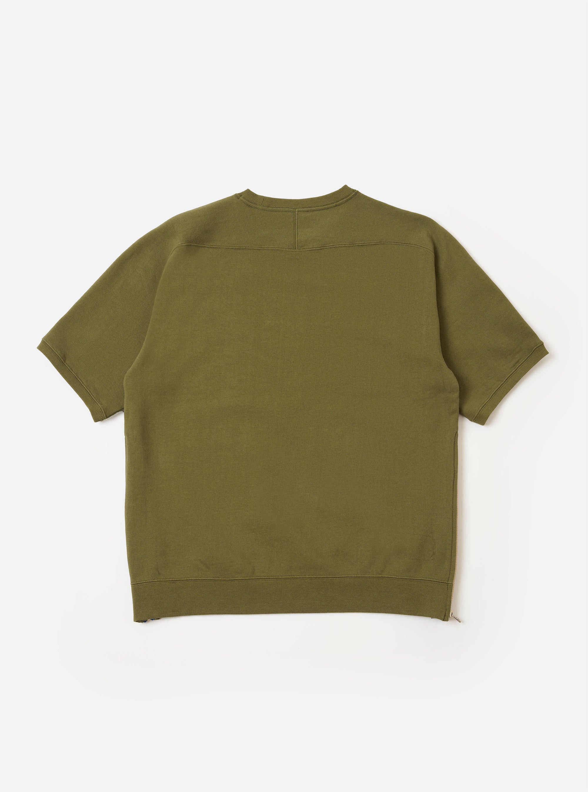 The master-piece x Universal Works Olive Brush Back Sweat S/S Billy Sweat is shown from the back as a flat lay against a plain white background. The short-sleeve sweatshirt features a ribbed collar and a small brand patch near the bottom hem.