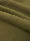 A close-up fabric swatch of the master-piece x Universal Works Olive Brush Back Sweat S/S Billy Sweat. The image displays the olive green color and the soft, textured surface of the brush back sweat fabric. No model or mannequin is present.