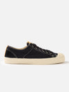 Side view of the Novesta for Universal Works Black Canvas Star Master shoe on a white background. The shoe is black canvas with a cream-colored sole.
