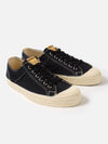 Studio shot of Novesta for Universal Works Black Canvas Star Master shoes. Black canvas upper, off-white rubber sole. White background.