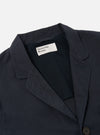 Close-up of the Navy Linen Slub Weave Three Button Jacket on a white background. Shows the lapel, buttons, and linen texture. The jacket's label is visible.