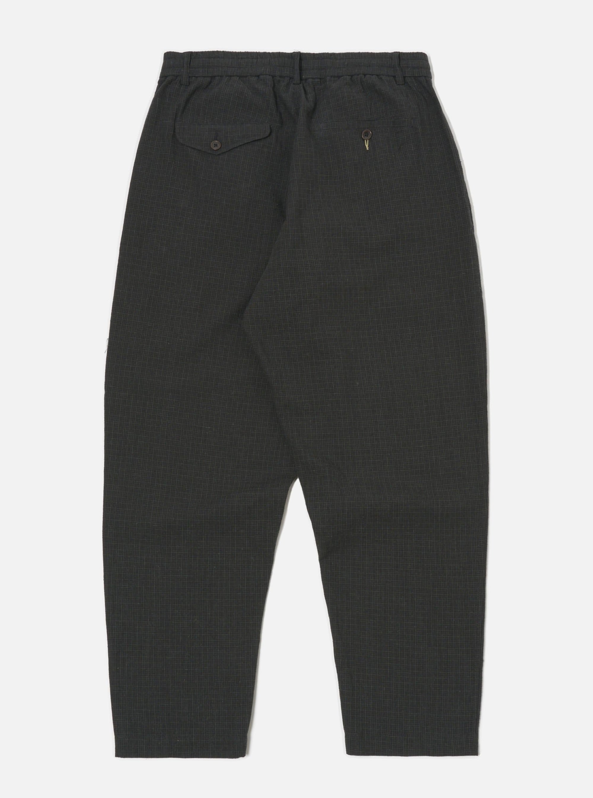 Studio shot of the back of Charcoal Fine Linen Mix Pleated Track Pant on a white background. The pants have a relaxed fit and visible pocket details.