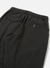Close-up of the back of Charcoal Fine Linen Mix Pleated Track Pant on a white surface. Details include buttoned pockets and an elastic waistband.