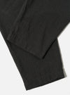 Close-up of the Charcoal Fine Linen Mix Pleated Track Pant on a white surface. The fabric shows a subtle texture and pleated details.