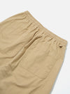 Close-up of the back of Sand Military Cotton Simple Short on a white surface. The sand-colored cotton shorts feature an elastic waistband and back pockets.