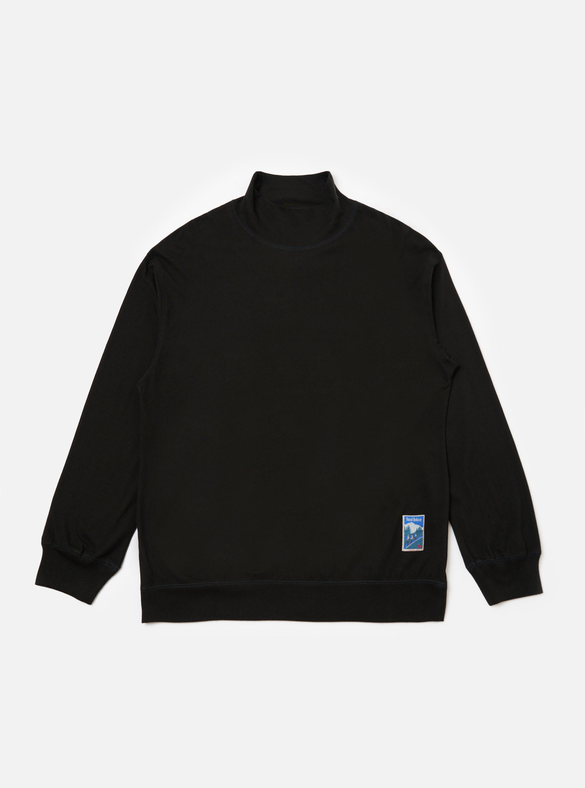 Studio shot of the Black Single Jersey Funnel Neck Tee, a long-sleeved black shirt with a funnel neck, laid flat on a white background. A small graphic is on the lower left.