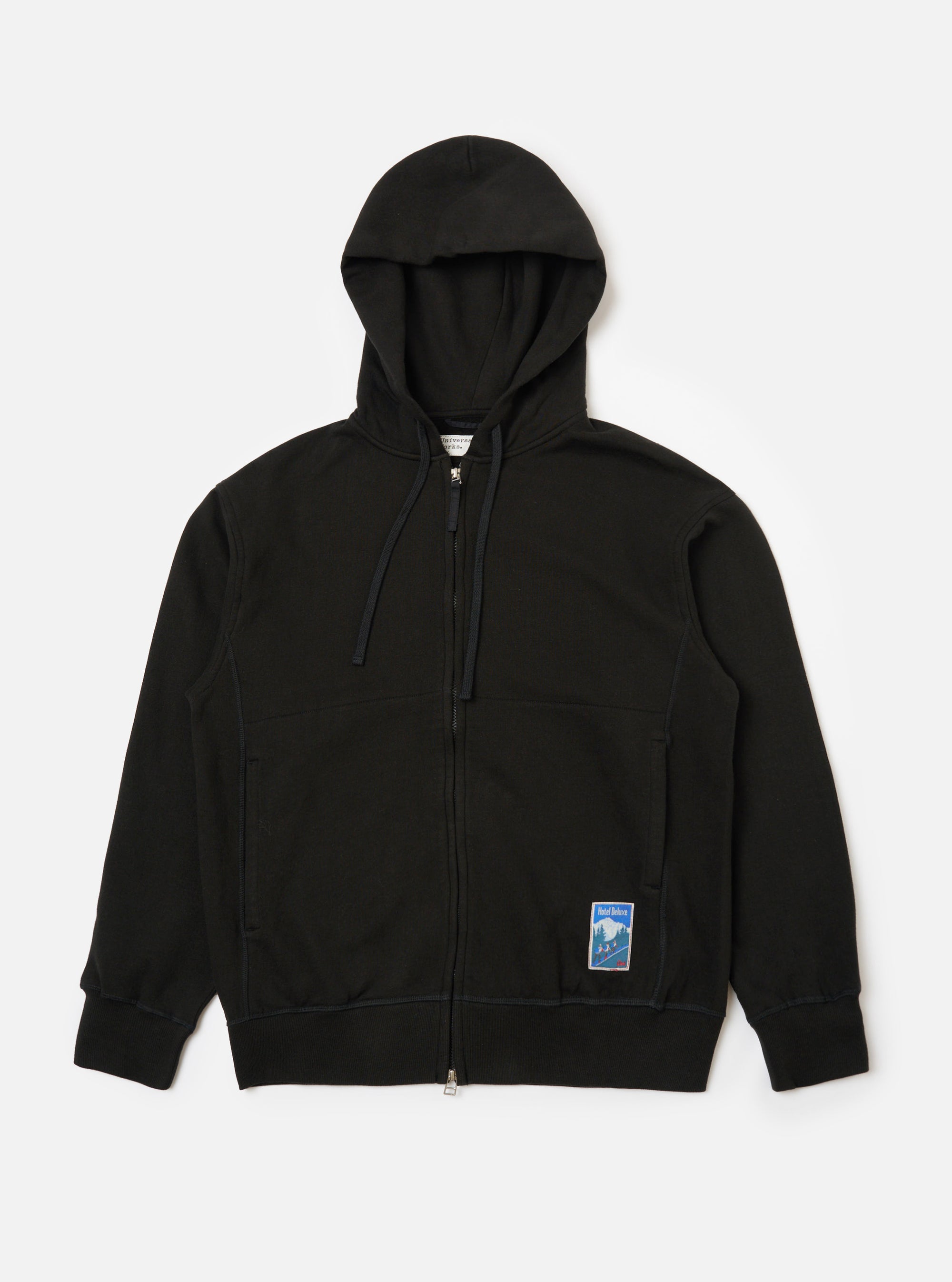 The Black Brush Back Sweat New York Hoody in black cotton blend, displayed flat on a white background. The hooded sweatshirt is fully zipped with a logo patch on the lower left.