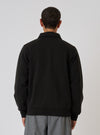 Back view of a model wearing the Black Brush Back Sweat Tyler Sweat Jacket. The jacket is black and the background is white.