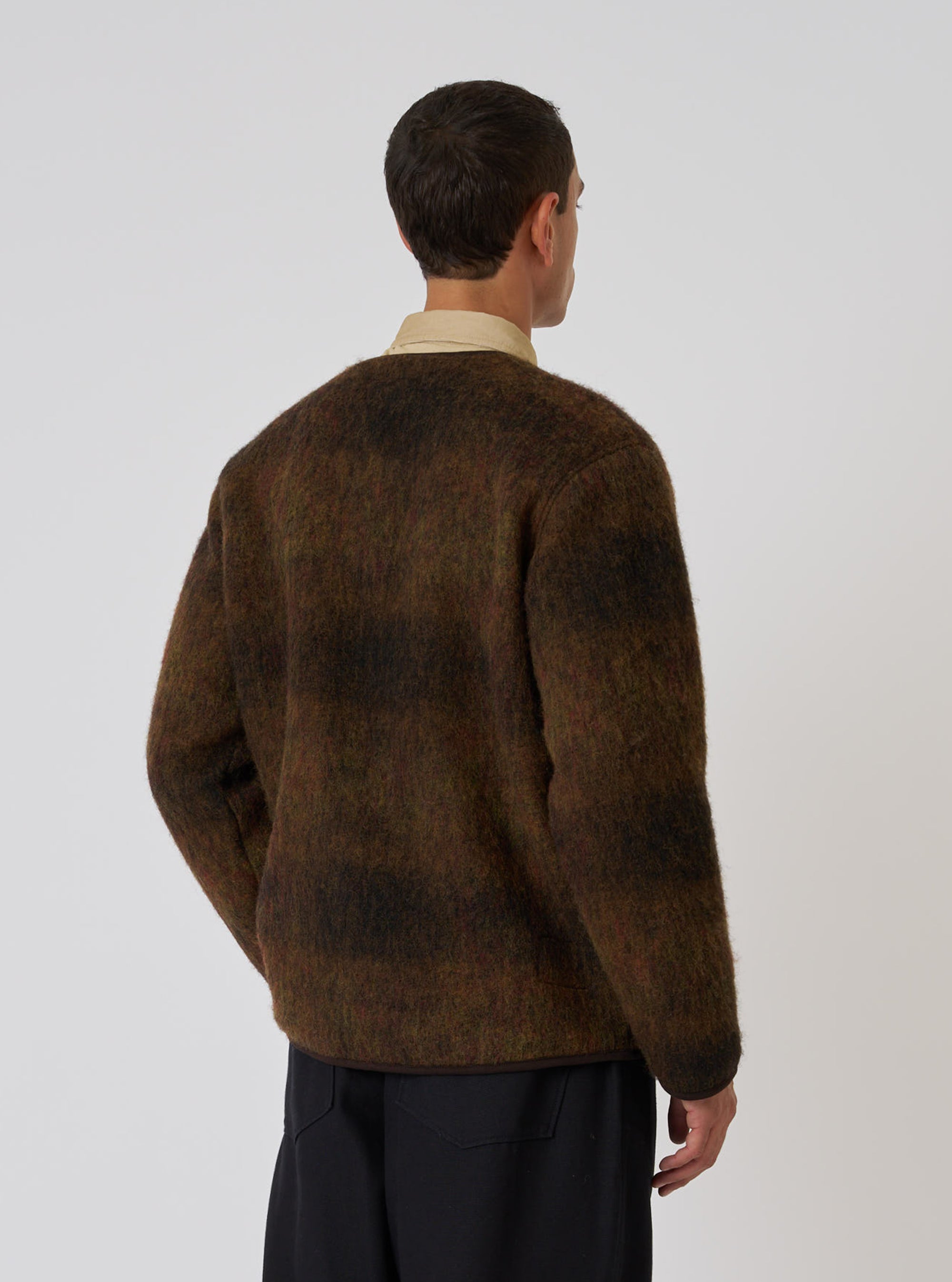 Back view of a model wearing the Brown Alps Fleece Zip Liner Jacket. The jacket is brown fleece, worn over a tan shirt. Shot against a white background.