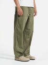 Model wears light olive twill Fatigue Pant (Undarted) on a white background. The pants are paired with suede shoes. The twill material has a subtle texture.
