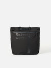 The Topologie x Universal Works Black UW Tech Helmet Bag on a white background. The bag is black with the brand names printed on the front.