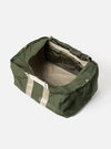 Open Topologie x Universal Works Rifle Green UW Tech Summit Duffle Large bag on a white background. The bag is rifle green with beige straps and a beige interior.