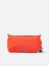 The Topologie x Universal Works Red UW Tech Bottle Sacoche Medium, a bright red bag with blue accents, is centered on a white background. The bag features the brand logos in blue.