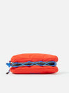Close-up of the Topologie x Universal Works Red UW Tech Bottle Sacoche Medium. Red fabric with blue cord detail. Shot on a white background.