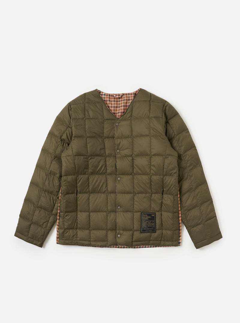 The TAION x Universal Works Reversible Dark Olive Military Line Liner Jacket is displayed on a white background. The jacket is quilted and shows a brown and beige houndstooth pattern on the inside.