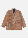 Flat lay of the TAION x Universal Works Reversible Dark Navy Military Line Kyoto Work Jacket. The jacket is brown plaid with a dark navy lining, on a white background.