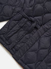 Close-up of the TAION x Universal Works Reversible Dark Navy Military Line Kyoto Work Jacket, showcasing its quilted texture and dark navy color on a white background.